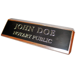This elegant, genuine Arkansas notary walnut desk, sign is made of solid wood and engraved on a metal plate with gold lettering with your notary name and the wording 'Notary Public'. It makes a fine addition to any desk or office. This sign can be customized with up to two lines.